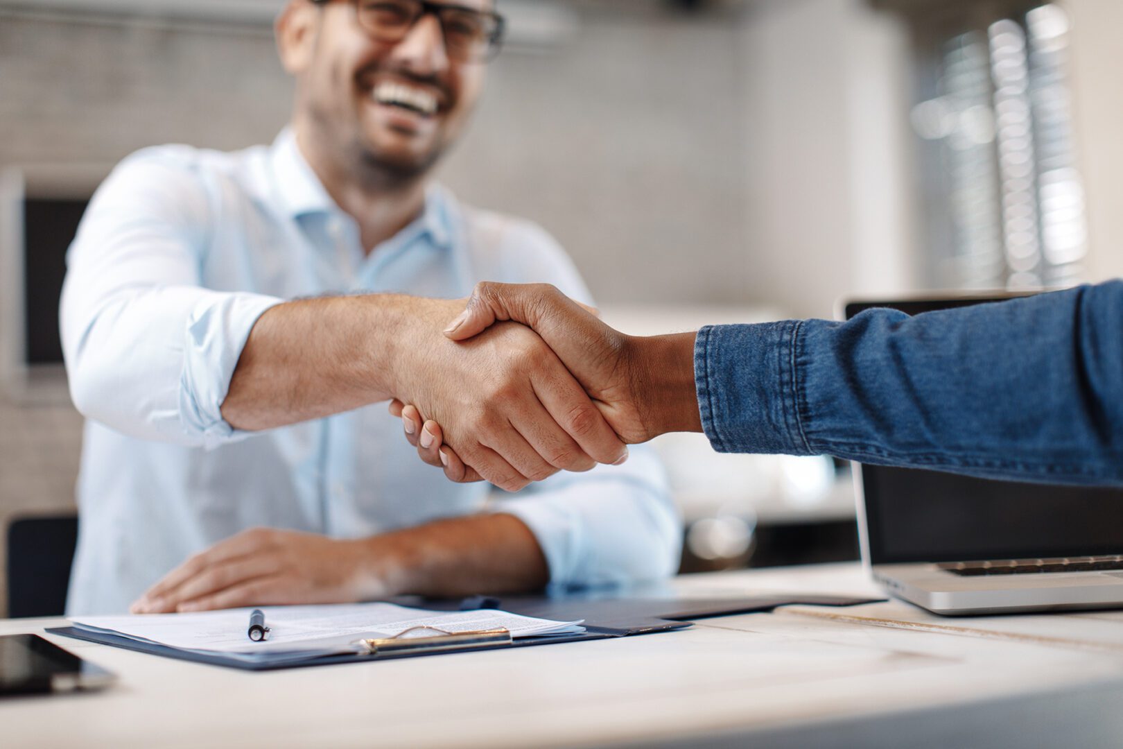 Close up of handshake in the office